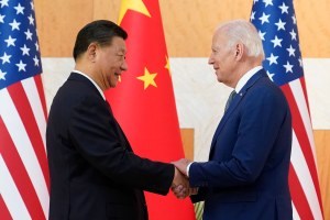 President Joe Biden and Chinese President Xi Jinping shake hands 