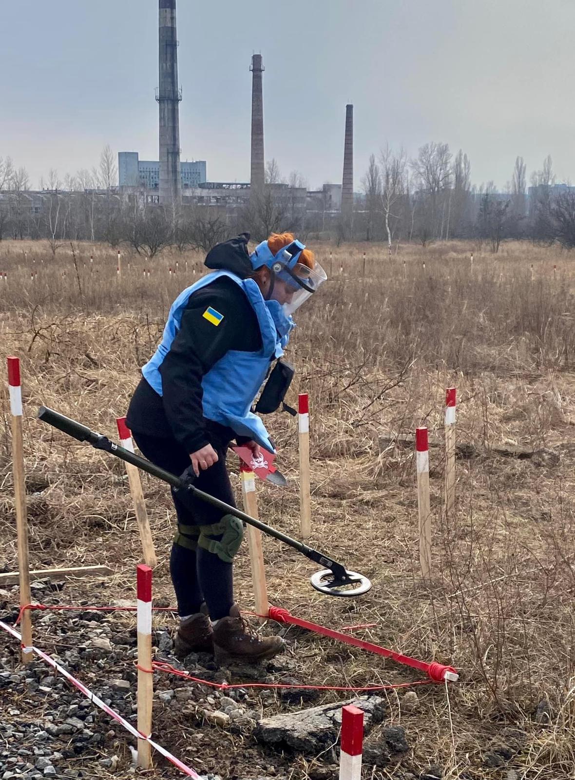 FSD staff practice using metal detectors to find landmines buried in the mud outside of Chernihiv. (credit: John Montgomery, FSD)