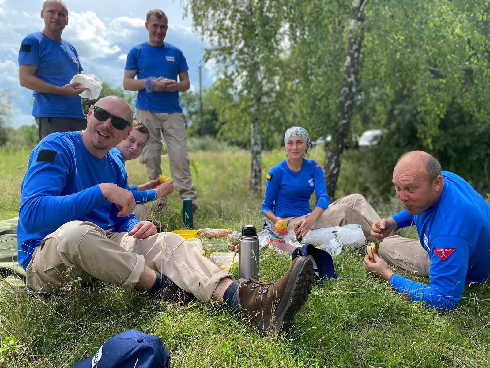FSD demining crew enjoys a lunch break in the field. (credit: John Montgomery, FSD)