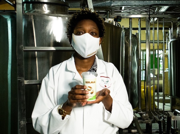 Woman working at food processing lab