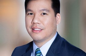 Headshot photograph of Kim H. Tran