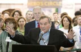 Richard M. Daley talks into a microphone at an event