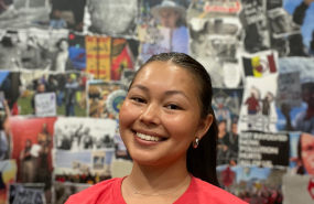 Jayden Lim is pictured from the shoulders up wearing a red t-shirt, smiling into the camera.