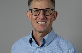 headshot of Joshua Busby