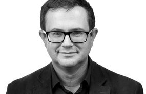 Headshot of David Henig.