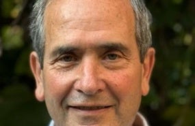 Man with short grey hair smiling