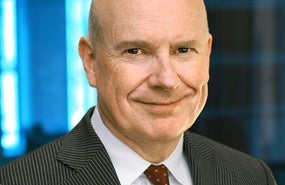 Portrait of Gerard Butler wearing striped suit jacket and red tie