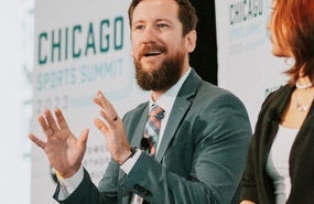 Adam Cook speaking on a panel.