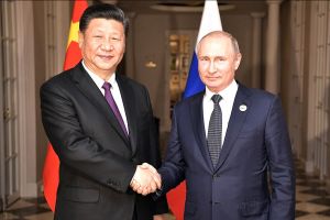 Vladimir Putin and Xi Jinping shaking hands on July 26, 2018.