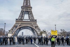 Yellow vest demonstrations in Paris, Eiffel Tower stands in the background