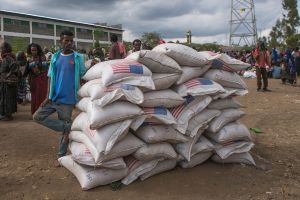 People wait at a USAID food distribution centre in Ethiopia.