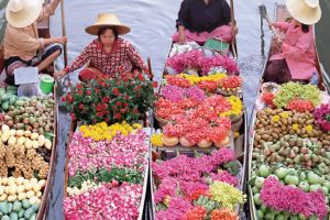 Women with crops in boats. 
