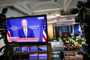 U.S. President-elect Joe Biden is seen making remarks on his plan to fight COVID-19 on a television monitor from the White House Briefing Room, in Washington