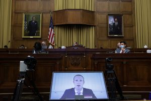 Mark Zuckerberg appears on a video feed testifying before Congress.