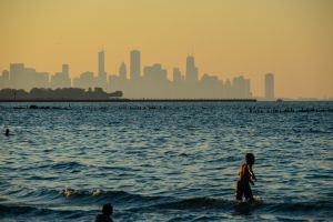People play in the water at a public beach at Chicago's South Shore Cultural Center