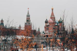 View of the Kremlin and St. Basil's Cathedral in Moscow, Russia during winter.