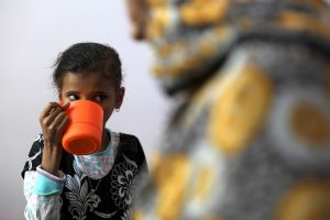 A malnourished girl receives food aid in Yemen 