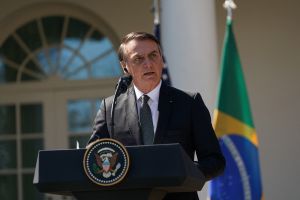 A man stands and speaks at a podium