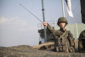 Republic of Korea Army 1st Lt. Choi Min Kyu points across the border into North Korea while briefing Vice President of the United States Joe Biden, at Observation Point Ouellette, South Korea, Dec. 7, 2013. 