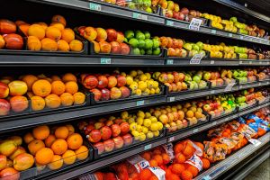 A shelf of fresh produce at a grocery store