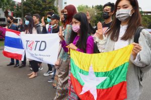 People show the three-finger salute against the Myanmar military coup as part of the Milk Tea Alliance united rally in Taipei, Taiwan