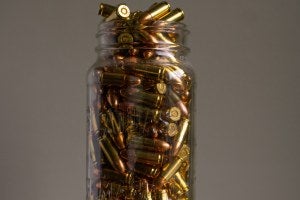 A glass jar full of bullets.