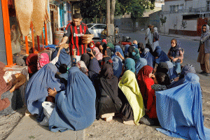 Afghans waiting for a piece of bread