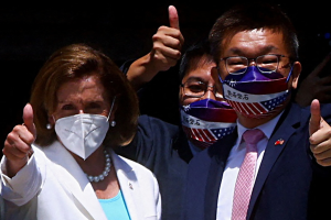 Speaker Nancy Pelosi gestures next to Legislative Yuan Vice President Tsai Chi-chang as she leaves the parliament in Taipei, Taiwan on August 3, 2022.