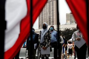 Citizenship candidates stand for a naturalization ceremony in New York City
