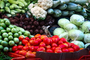 A variety of vegetables are pictured at a grocery store.