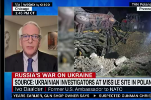 Screenshot of Ivo speaking on CNN Newsroom next to footage of the missile explosion site in Poland. 