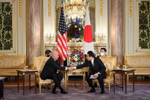 US President Joe Biden and Japan's Prime Minister Fumio Kishida shake hands