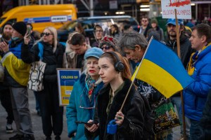 Ukraine supporters gather in Times Square to protest Russia's participation in the 2024 Summer Olympic Games, in New York, NY on February 11, 2023. 