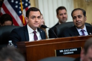 Representative Mike Gallagher and Representative Raja Krishnamoorthi before a House Select Committee on the Chinese Communist Party hearing 