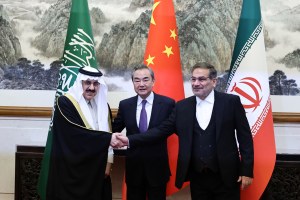 China's director of the Office of the Central Foreign Affairs Commission Wang Yi, Ali Shamkhani, the secretary of Iran's Supreme National Security. 