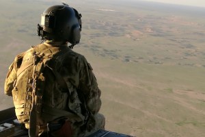 a soldier overlooks Iraq
