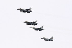 Taiwanese F-16 jet fighters fly in close formation during a navy exercise
