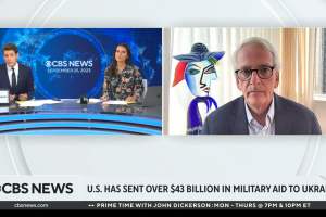 Ivo Daalder on CBS News at right, anchors at left in front of a blue background. 
