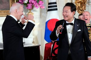 President Joe Biden reacts as South Korea's President Yoon Suk Yeol sings the song American Pie 