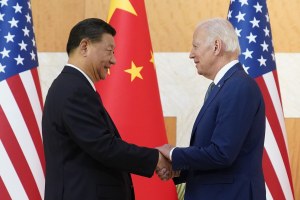 US President Joe Biden, right, and Chinese President Xi Jinping shake hands before their meeting on the sidelines of the G20 summit meeting