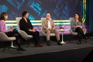 Four panelist on stage at the Pritzker Forum on Global Cities