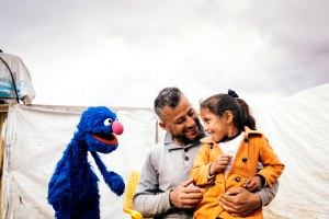 Grover with father and daughter