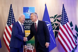 President Joe Biden shakes hands with NATO Secretary General Jens Stoltenberg