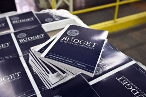 copies of a federal budget book on a table