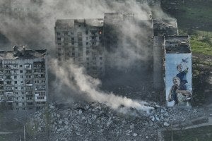  Smoke rises from a building in Bakhmut