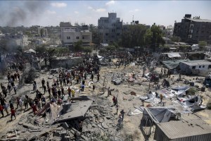 Palestinians inspect the damage at a site hit by an Israeli bombardment on Khan Younis, southern Gaza Strip