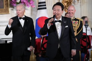 President Joe Biden reacts as South Korea's President Yoon Suk Yeol sings the song American Pie