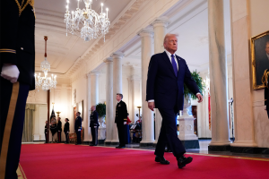 President Trump walking through the White House