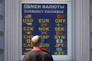 A man stands at a currency exchange office in St. Petersburg, Russia