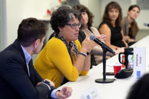 A woman asks a question during an Emerging Leaders roundtable.